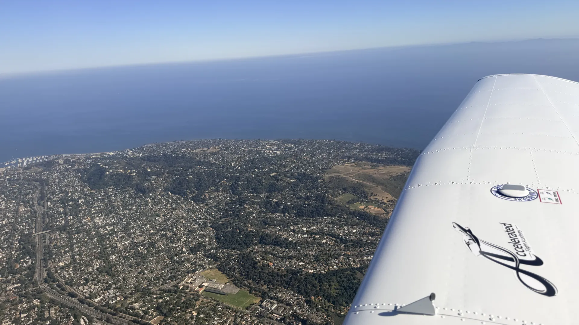 Southern California coastline seen from the wing of an Accelerated Flight School aircraft